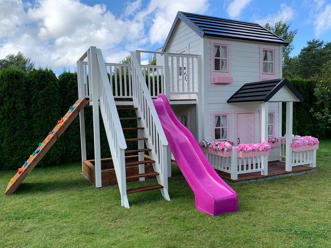 2- story Wooden Playhouse with pink slide, wooden terrace and flower boxes by WholeWoodPlayhouses