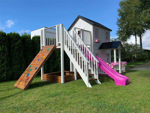2-Story white and pink wooden playhouse Princess with climbing wall, wooden balcony  and sandbox by WholeWoodPlayhouses
