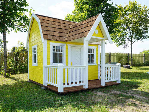 Outside of Kids Playhouse Sunny Sadie | yellow Outdoor Playhouse by WholeWoodPlayhouses