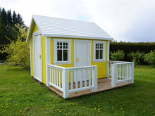 Load image into Gallery viewer, Yellow Wooden Playhouse Sunshine with white door and terrace on green lawn in a backyard by WholeWoodPlayhouses

