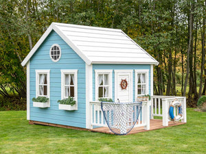 Decorated Wooden Outdoor Playhouse Bluebird with round top window, white flower boxes, Wooden Terrace and White Wooden Railing by WholeWoodPlayhouses