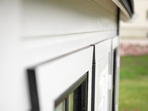 Close up of the white and black Window trim of Kids Outdoor Playhouse Arctic Auk by WholeWoodPlayhouses