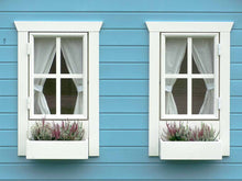 Load image into Gallery viewer, Wooden Playhouse in blue color Close up of two windows with white  curtains and flower boxes and blue wall by WholeWoodPlayhouses
