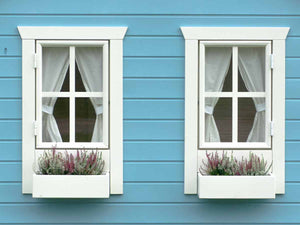 Wooden Playhouse in blue color Close up of two windows with white  curtains and flower boxes and blue wall by WholeWoodPlayhouses
